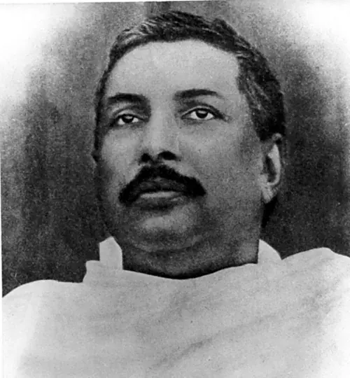 Early portrait of Sri Sri Thakur Anukulchandra as a young man, a white shawl around his shoulders