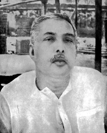 Portrait of Sri Sri Thakur Anukulchandra in his later years, in a white kurta
